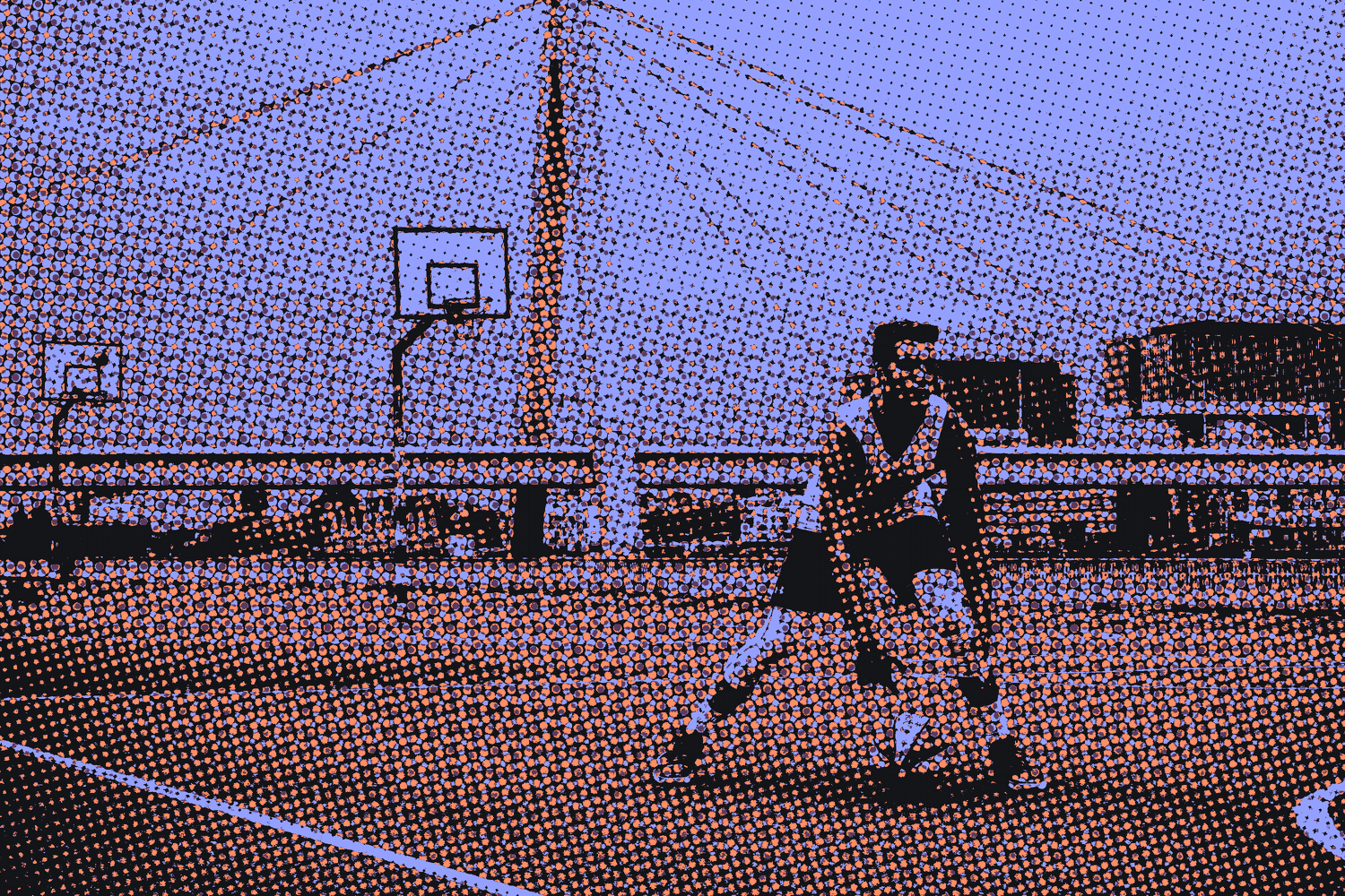 A player dribbling on an outdoor court under a bridge