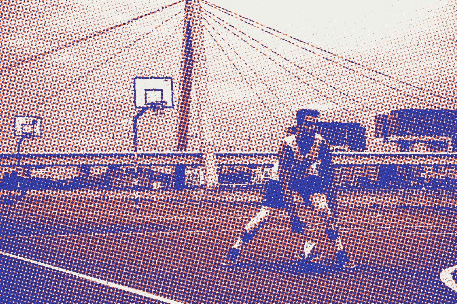 A player dribbling on an outdoor court under a bridge