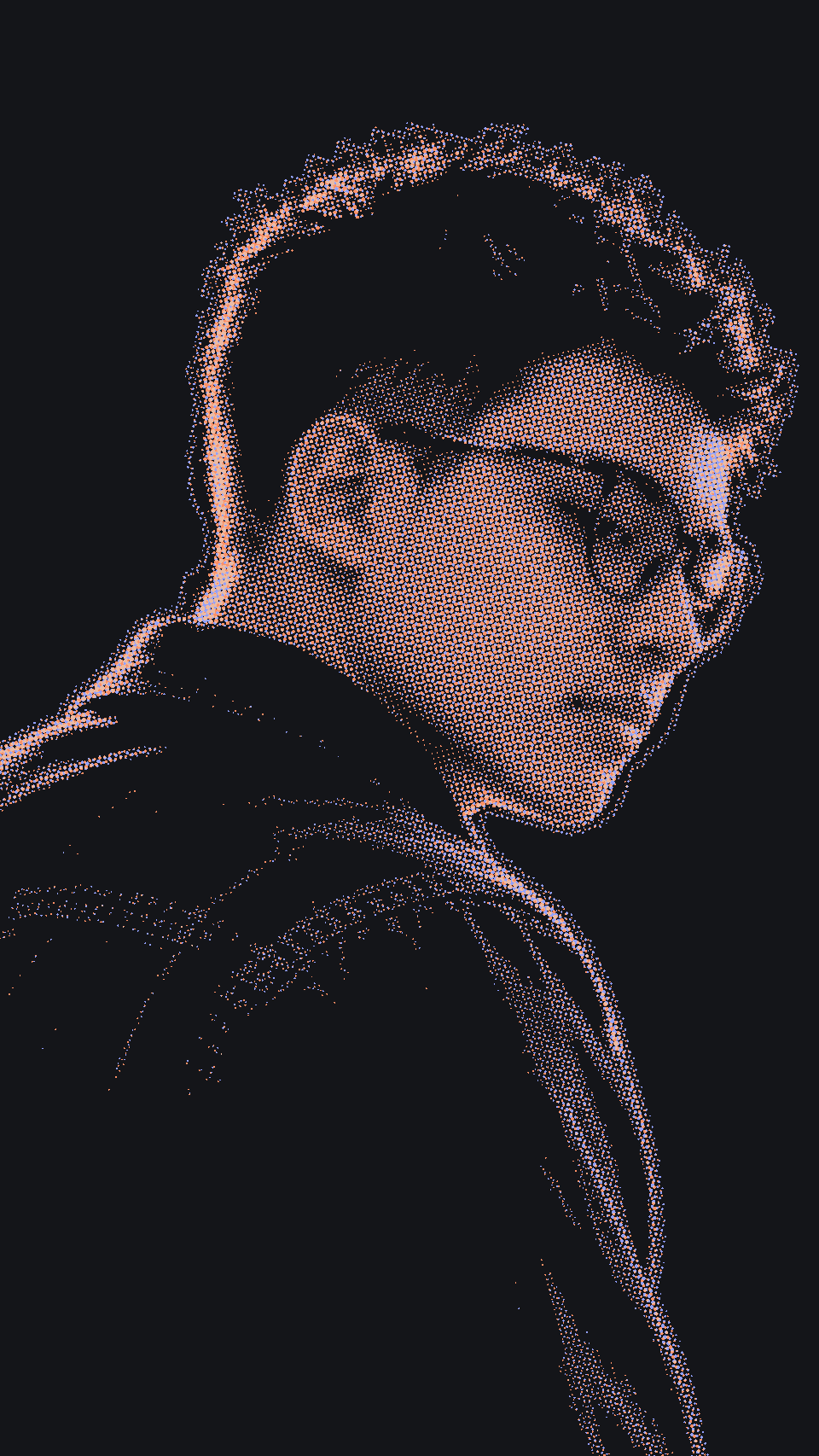 Portrait of Hery in profile, rim-lit, with round glasses and a denim jacket