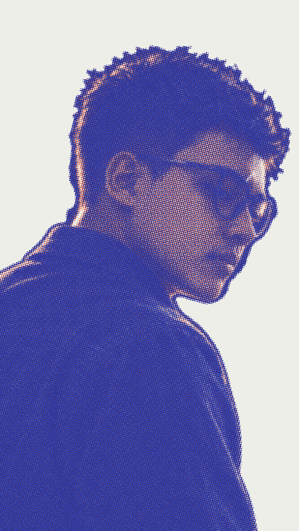 Portrait of Hery in profile, rim-lit, with round glasses and a denim jacket